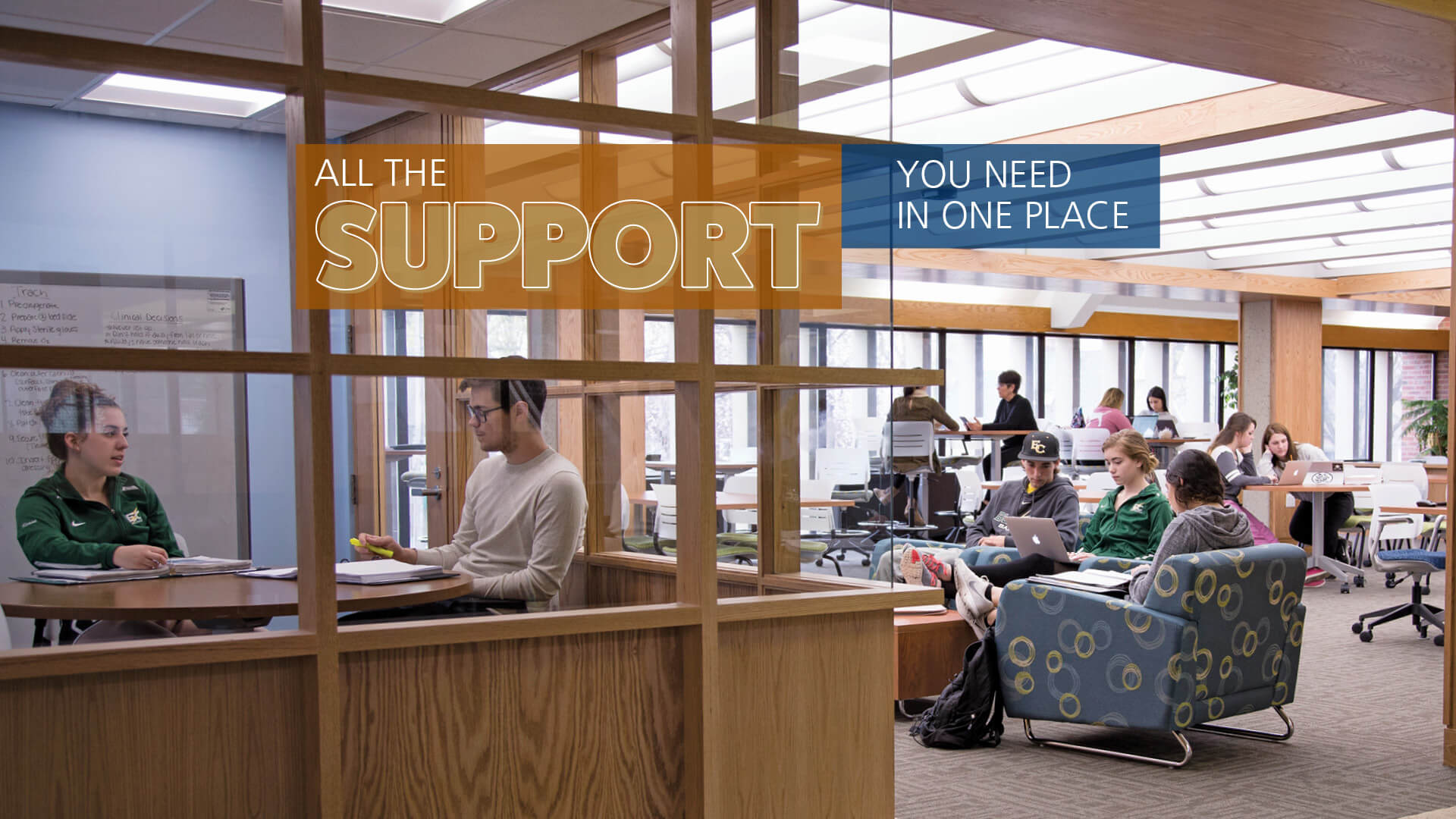 Students in the Center for Student Success, on the second floor of Elms College Alumnae Library with text reading 'All the support you need, in one place